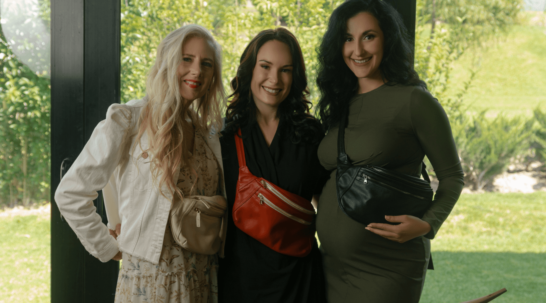 Women excited for the A Girl and A Gun National Conference wearing Zendira Friday Concealed Carry Belt Bags