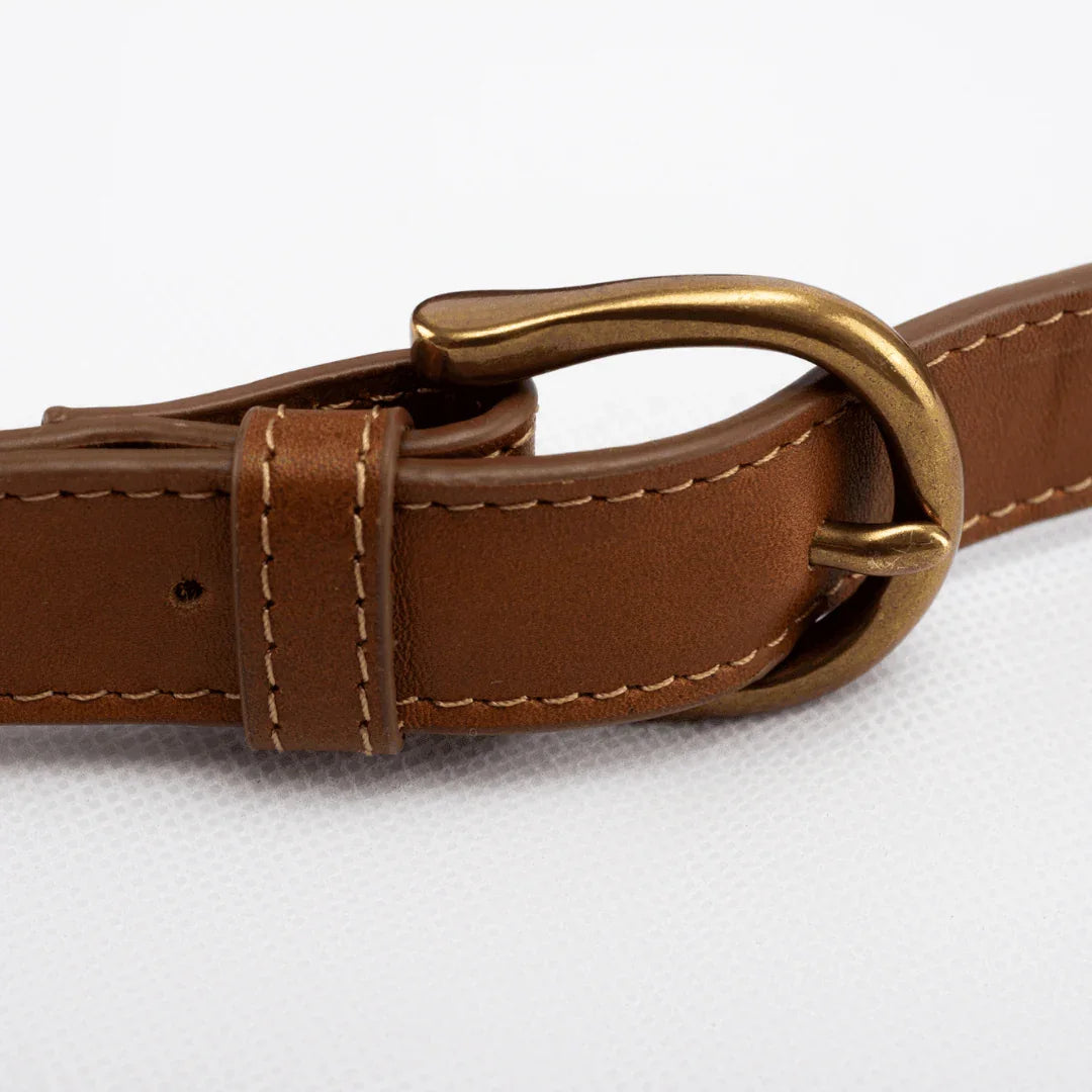 Close-up of a Zendira leather strap, featuring the sleek exterior and built-in cut-resistant webbing for discreet anti-theft protection.