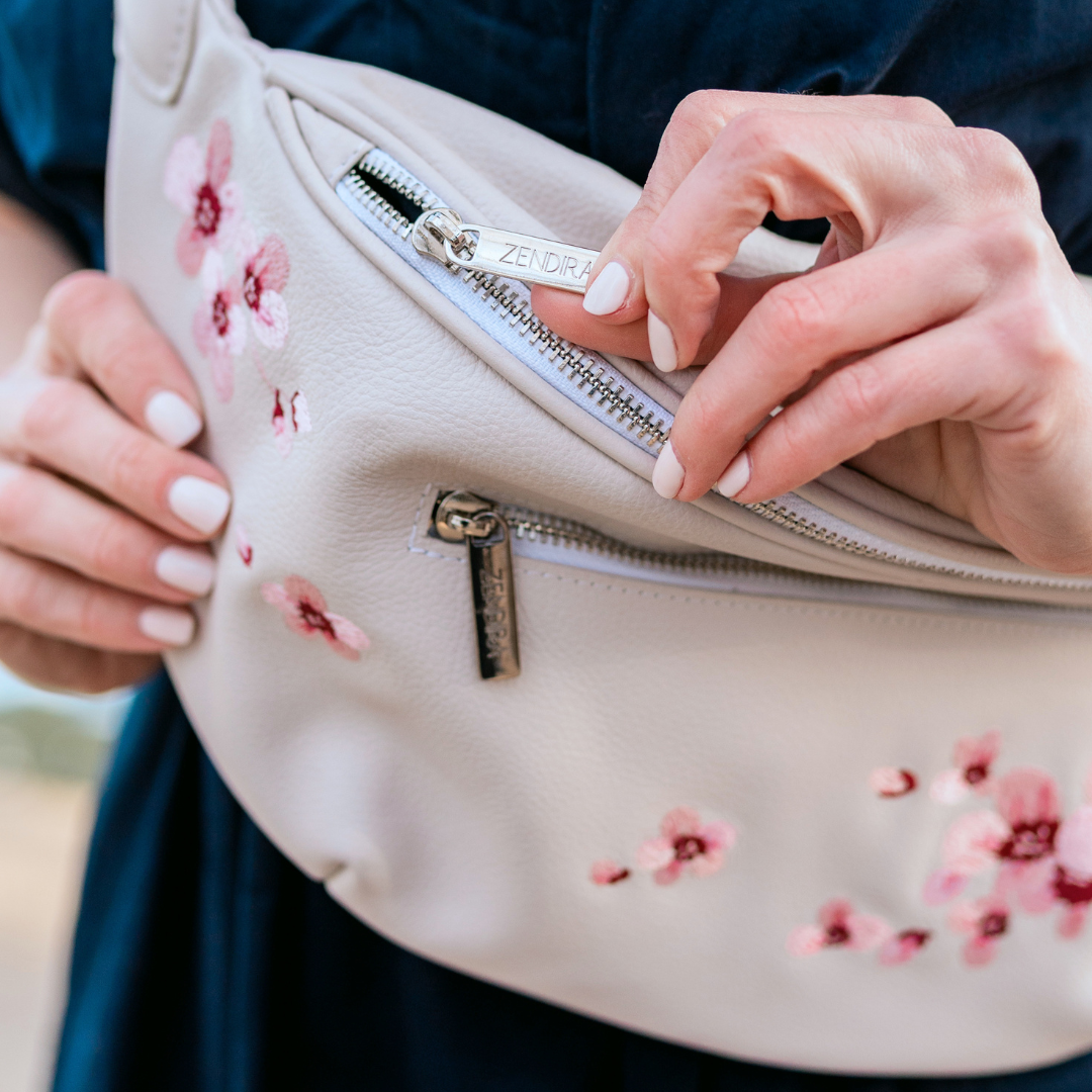 Embroidered cherry blossoms on the Zendira Saturday concealed carry bag outside.