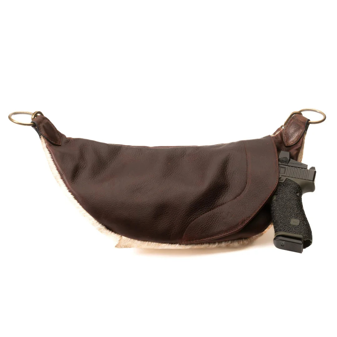 Back view of the Jessie Harrison x Zendira concealed carry crossbody bag with firearm