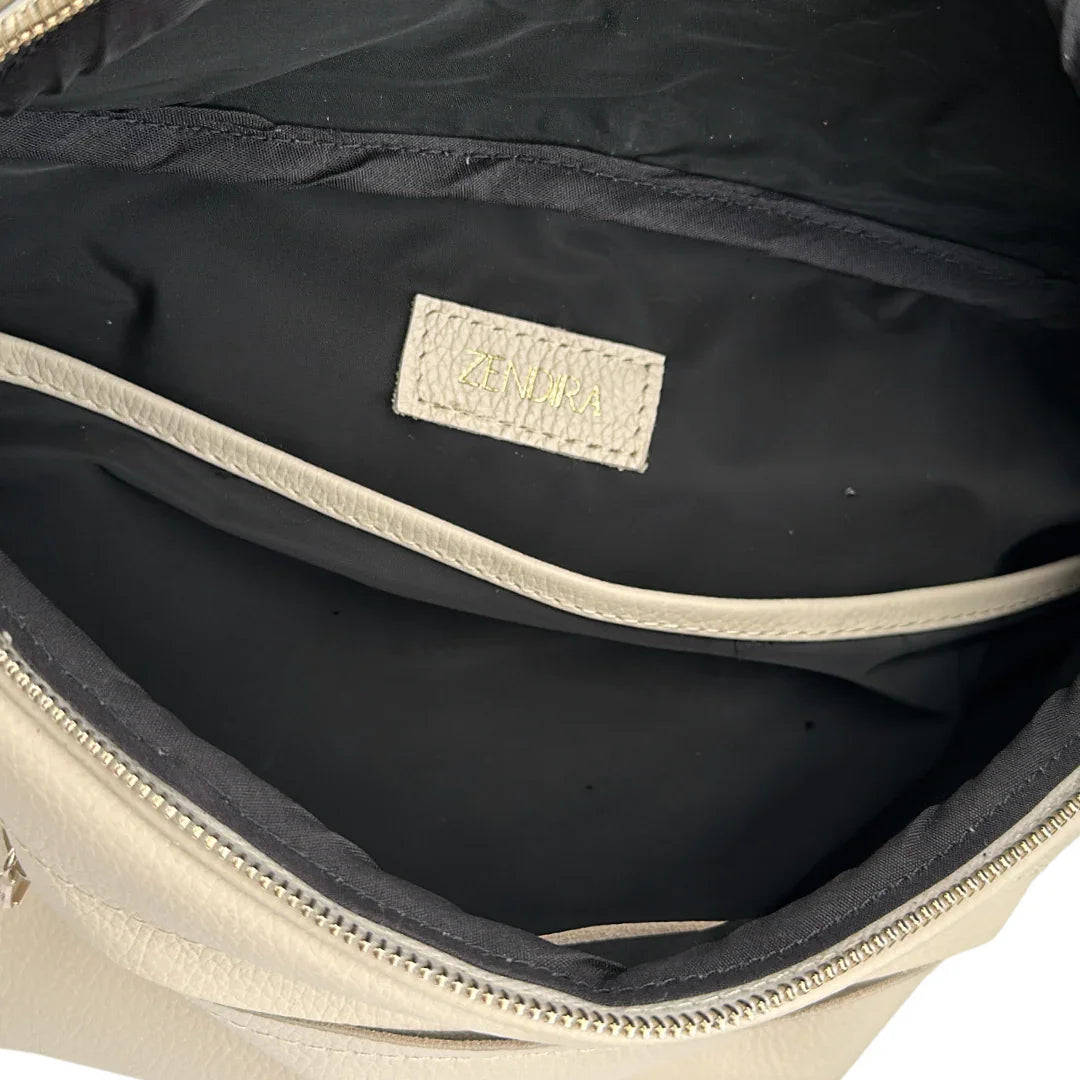 Interior view of the Zendira Saturday concealed carry crossbody in Pearl
