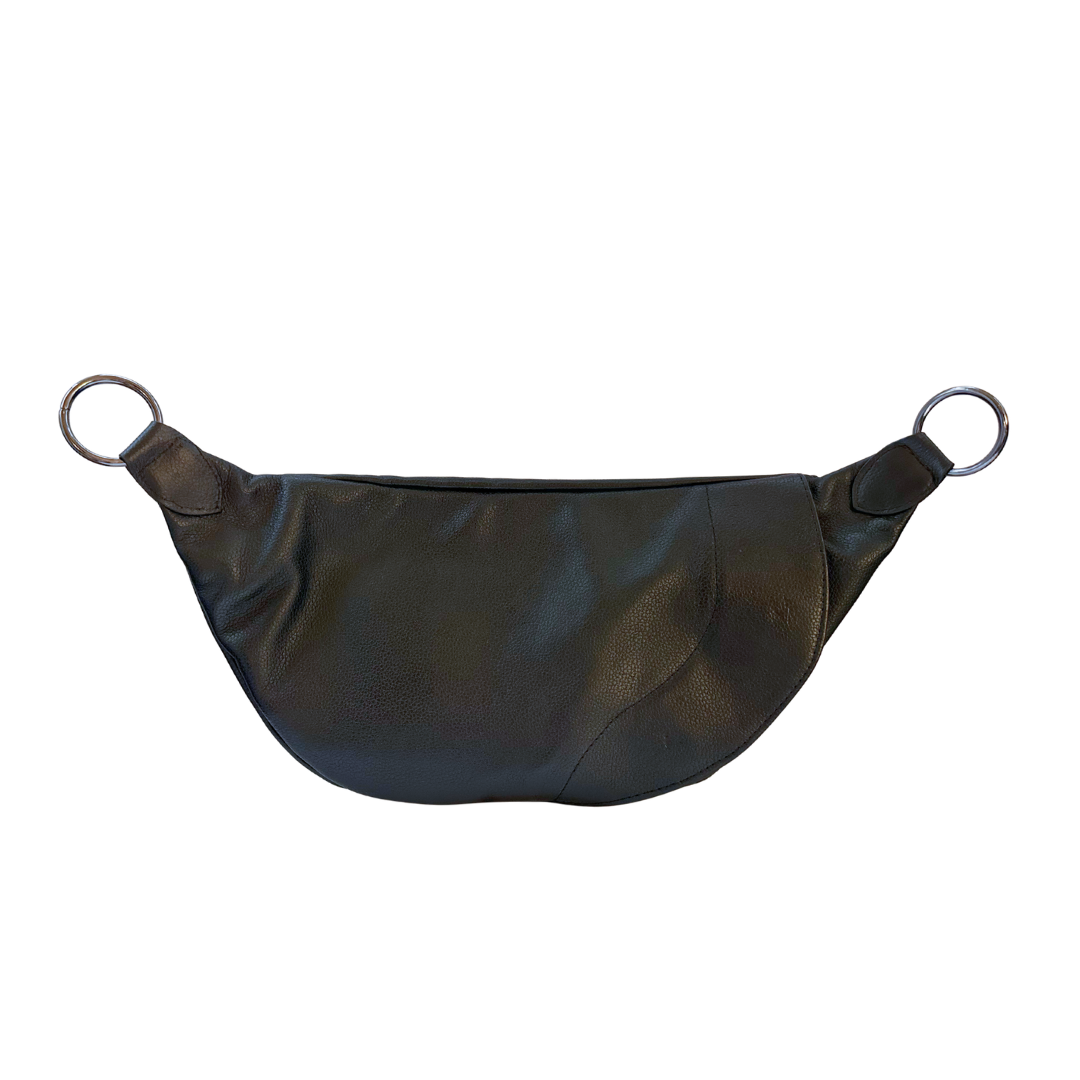 Smoke Zendira Saturday concealed carry crossbody bag with gun metal hardware and pebbled black leather showing the magnetic entry on the back.