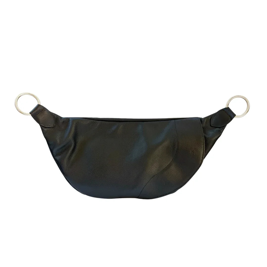 Product image showing how the magnetic opening of the Stiletto Zendira Saturday concealed carry crossbody bag works.