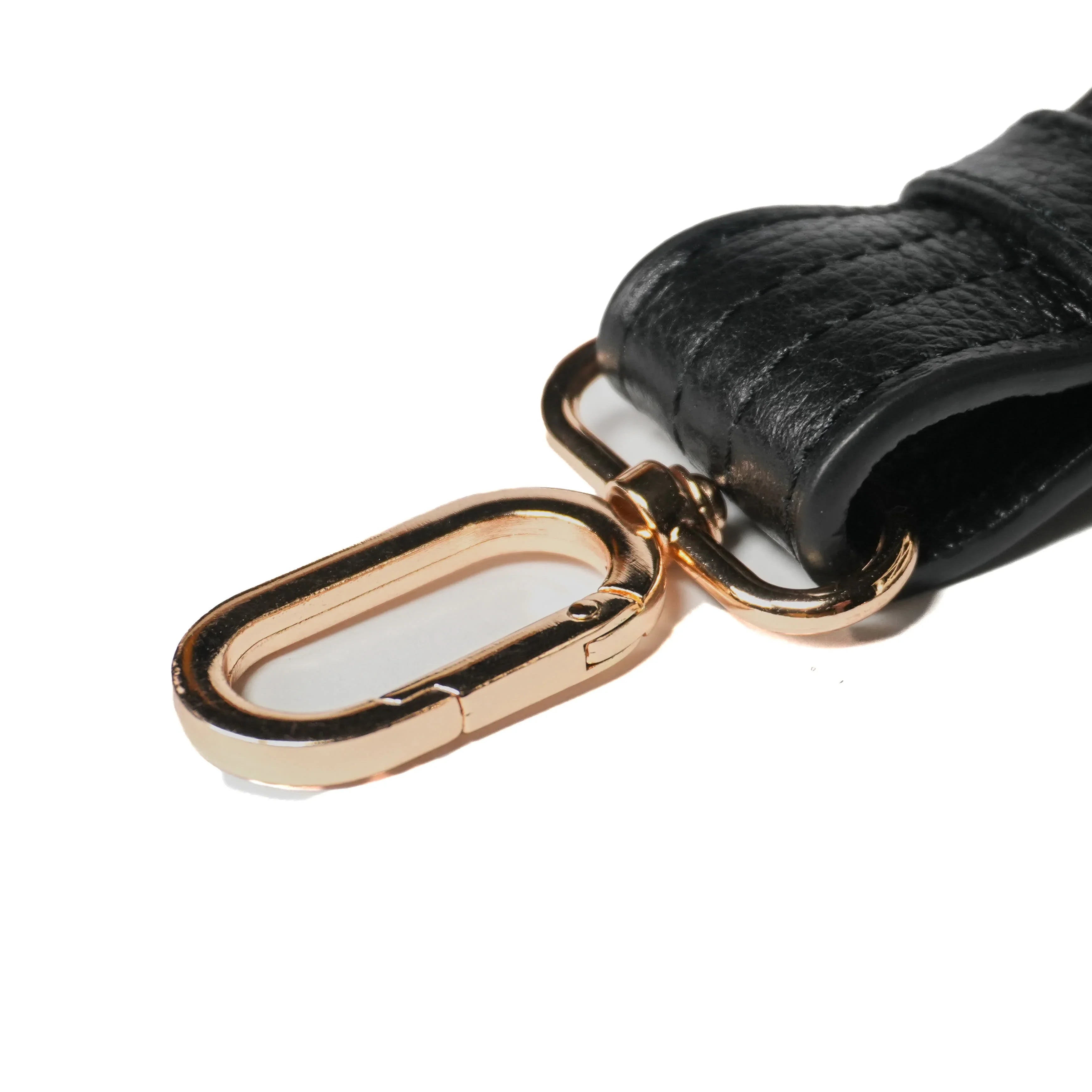 Close-up of cut-resistant strap and gold hardware on Zendira Sofia concealed carry bag