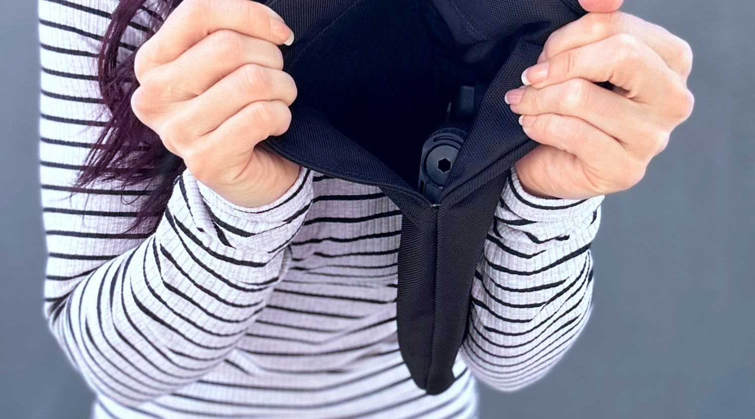 Woman with a Zendira Active Friday Concealed Carry Belt Bag showing the Sig Sauer ROSE Edition inside.