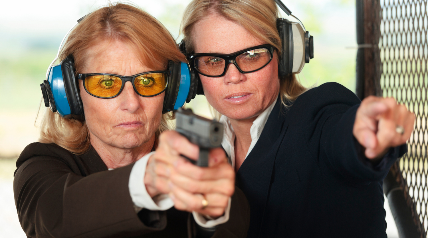 Two women at the gun range selecting the best gun for women
