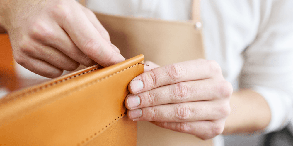 Designer concealed carry purse (concealed carry handbag) being sewn.