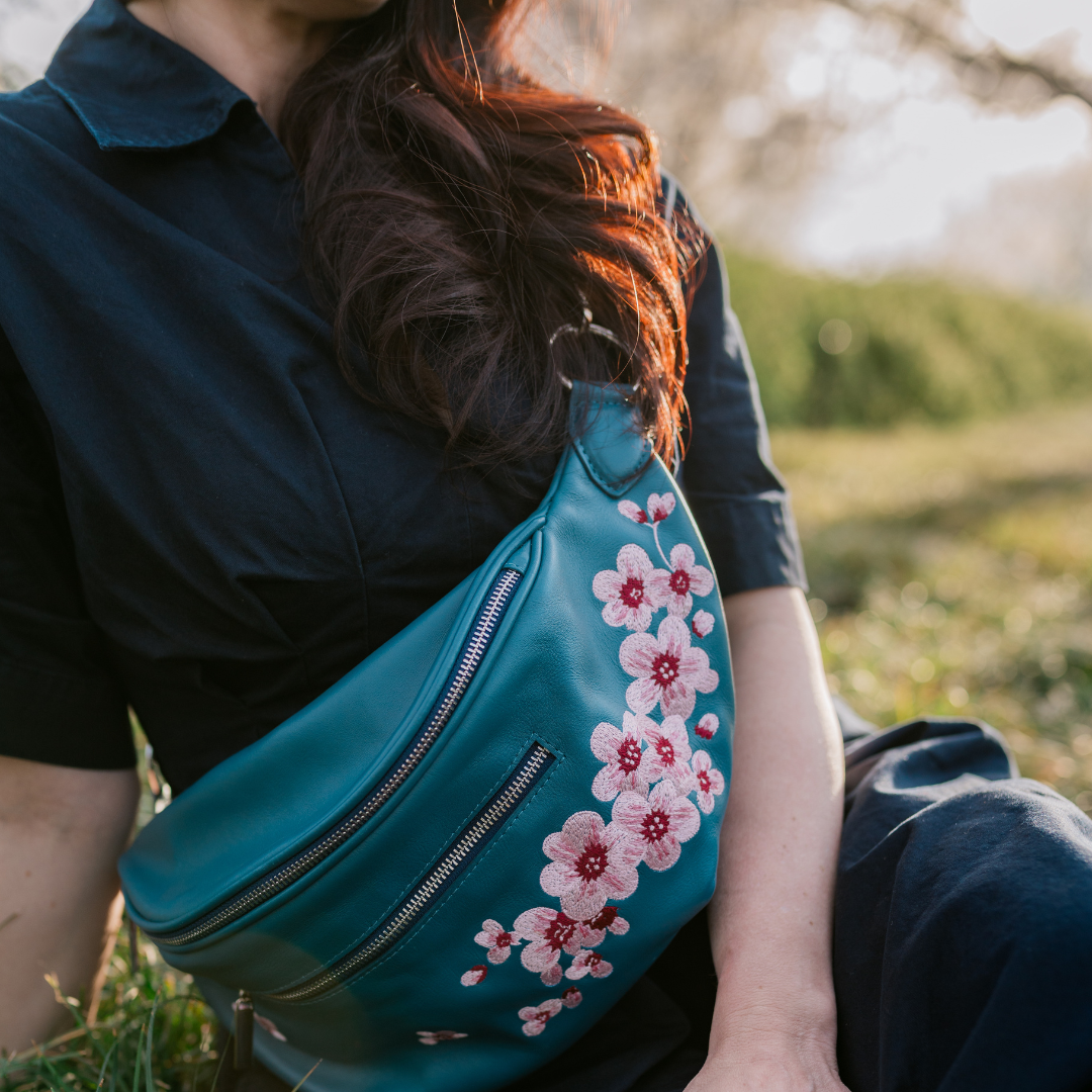 Embroidered cherry blossoms on the Zendira Saturday concealed carry bag outside.