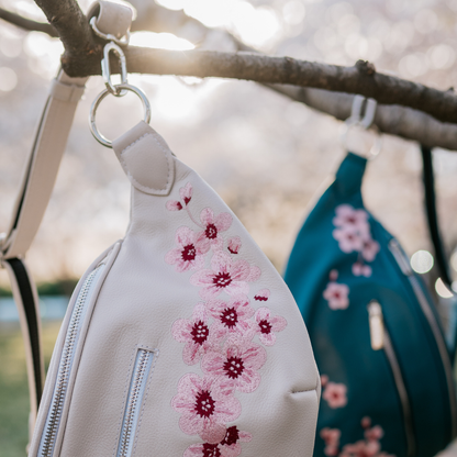 Embroidered cherry blossoms on the Zendira Saturday concealed carry bag outside.