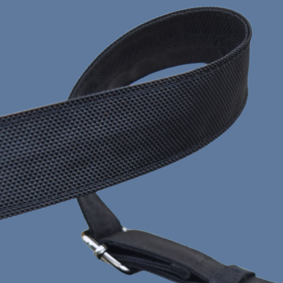Black Zendira Active Friday cut-resistant strap with a metal buckle on a blue background