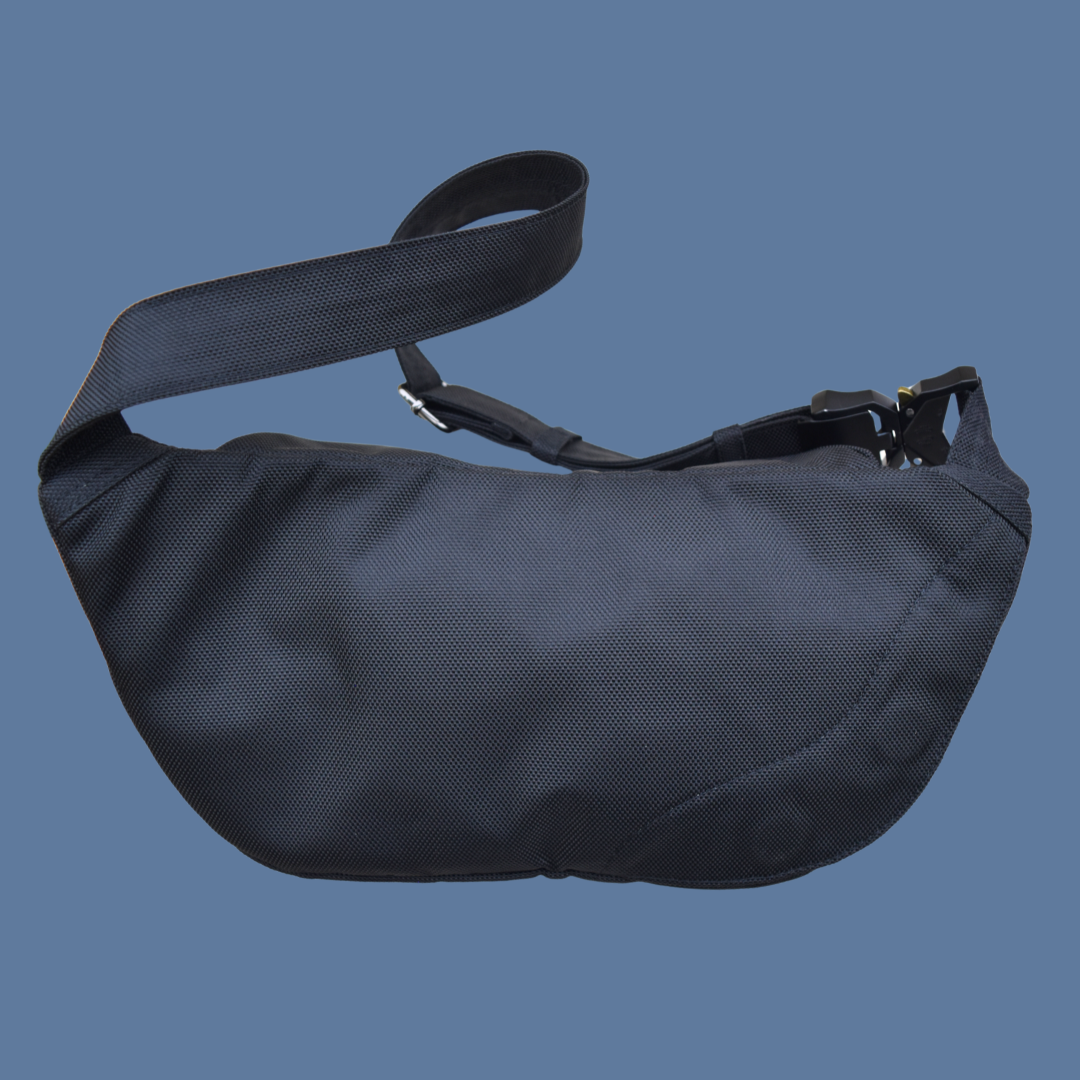 Black Zendira Active Friday concealed carry belt bag on a blue background