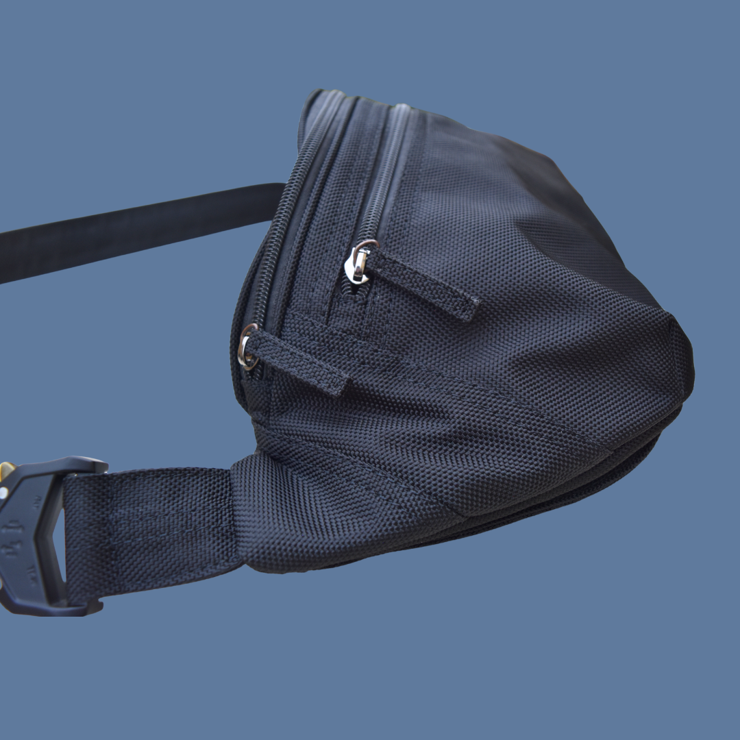 Black Zendira Active Friday concealed carry bag with a strap on a blue background