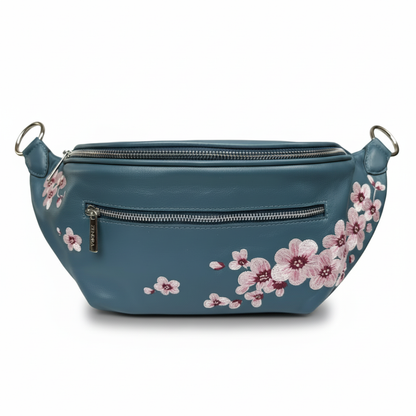 Embroidered cherry blossoms on the Zendira Saturday concealed carry bag in blue.