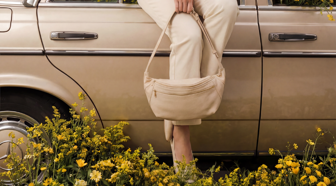 Hero image of a woman holding the Full Size friday bag by Zendira in Pearl
