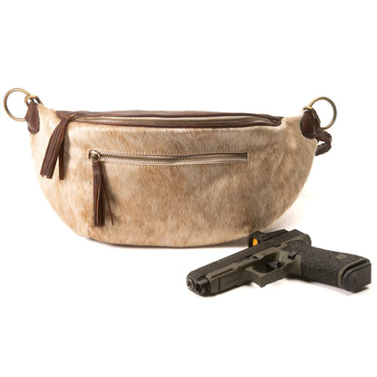Jessie Harrison x Zendira concealed carry crossbody shown with compatible firearm