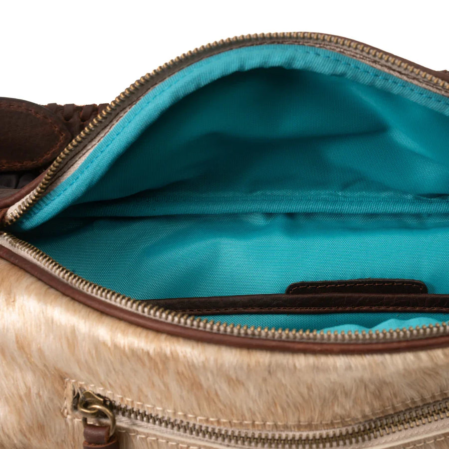 Jessie Harrison x Zendira concealed carry crossbody shown with turquoise interior
