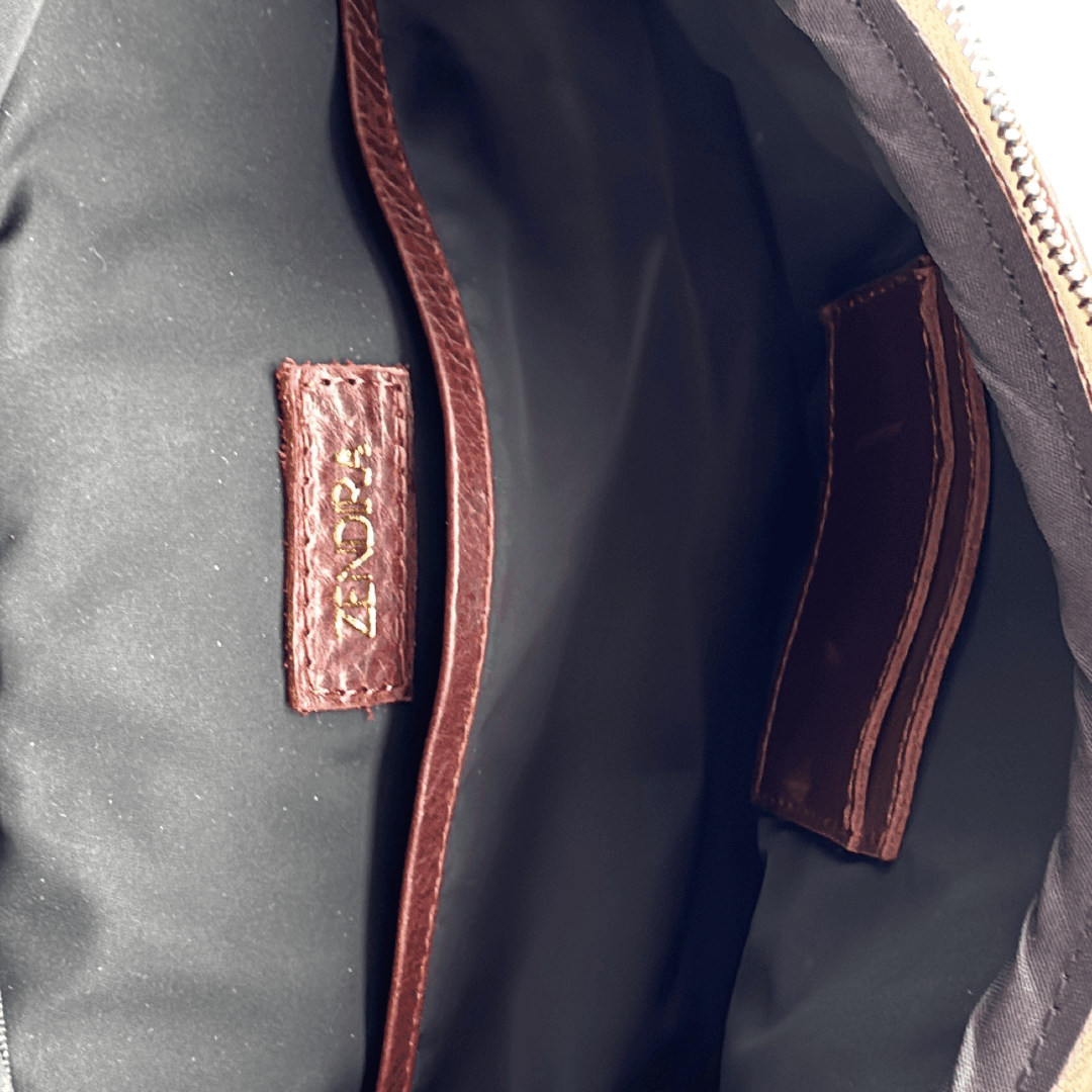 Interior view of the Zendira Saturday concealed carry bag with organized compartments