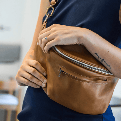 Model wearing the Zendira Saturday concealed carry crossbody in Cafe Con Leche casually