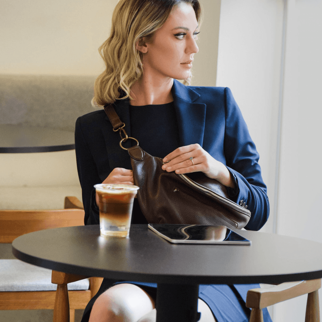 Model wearing the Zendira Saturday concealed carry crossbody in Coco Creme
