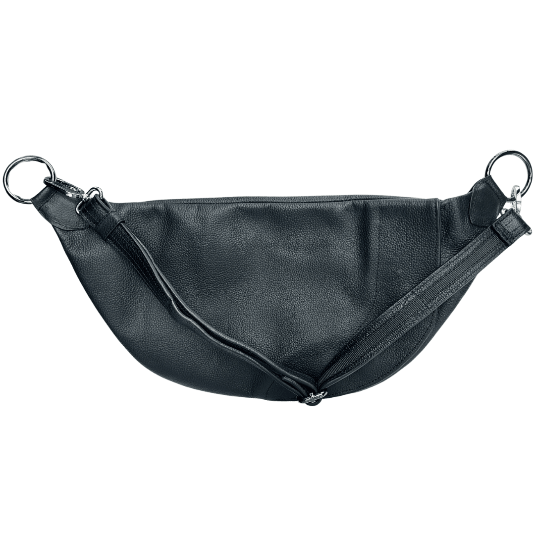 Leather strap detail on the back of a Zendira Saturday concealed carry crossbody