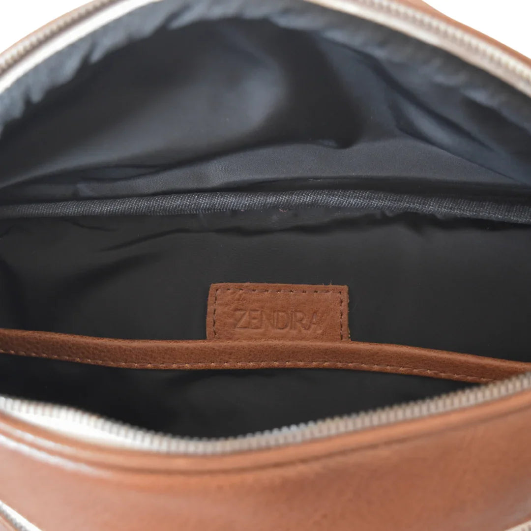 Interior view of the Zendira Saturday concealed carry crossbody bag with the zipper open