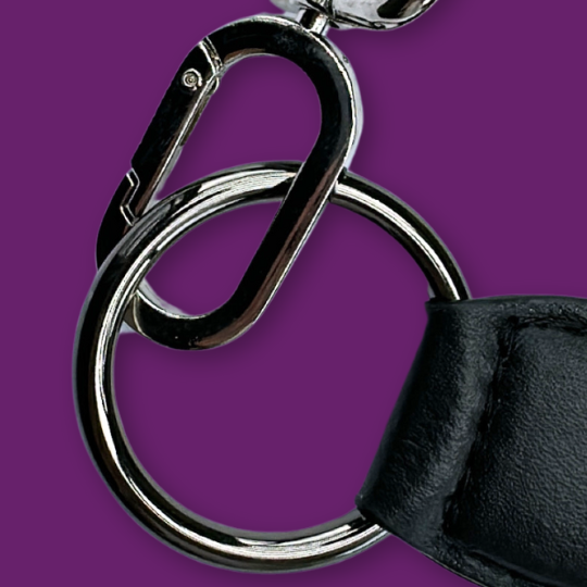 Zendira Saturday bag hardware in the luxe high quality gun metal finish on purple background.