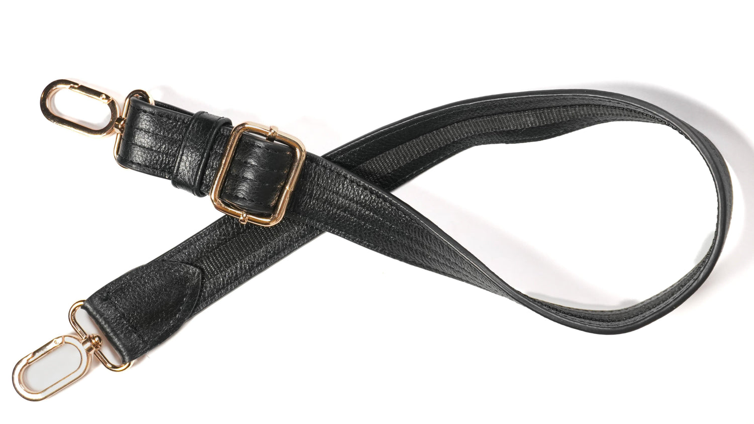 Close-up of cut-resistant strap and gold hardware on Zendira Sofia concealed carry bag