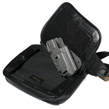 Close-up of magnetic closure on Zendira Sofia concealed carry bag in stiletto black leather